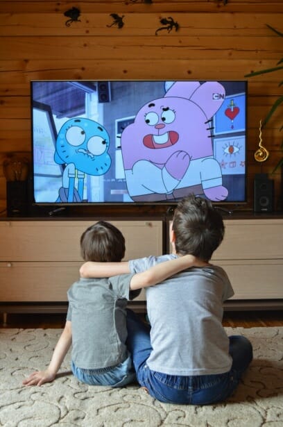 children watching cartoon on tv