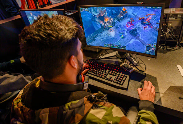 Guy playing a game on a monitor